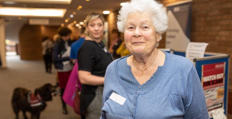 Elderly woman smiling at the camera