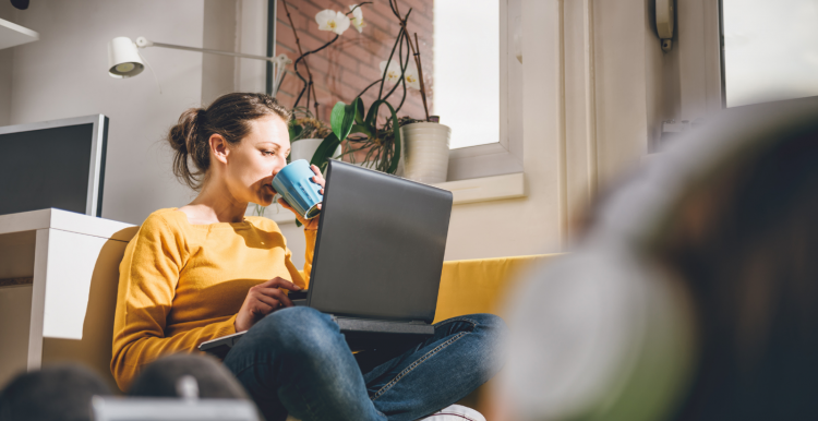 Person sat at home with their laptop