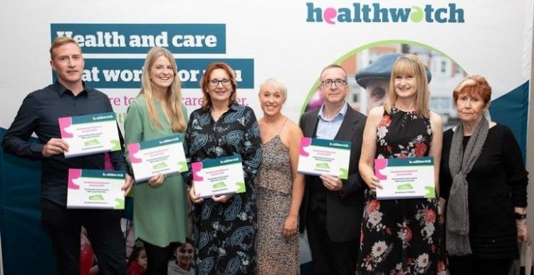 Healthwatch staff from across Greater Manchester holding their award certificates