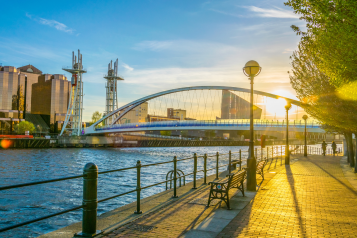 Photo of two people jogging by Salford Quays